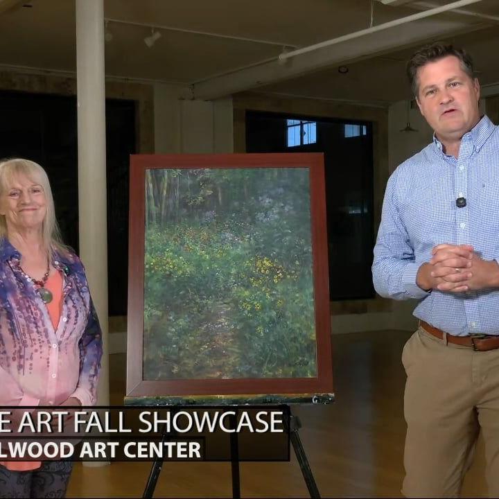 Keith Kaiser talks with one of the artists featured at the Fine Arts Fall Showcase